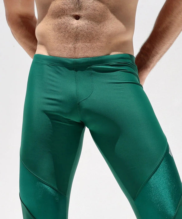 https://sexymenunderwear.com/cdn/shop/files/rufskin-sport-legging-lewis-premium-shape-retention-stretch-nylon-leggings-green-30509728235629_584x700.jpg?v=1695405849